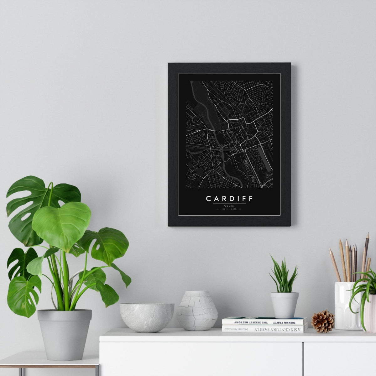 Cardiff street map poster in black, minimal city map print framed on a living room wall