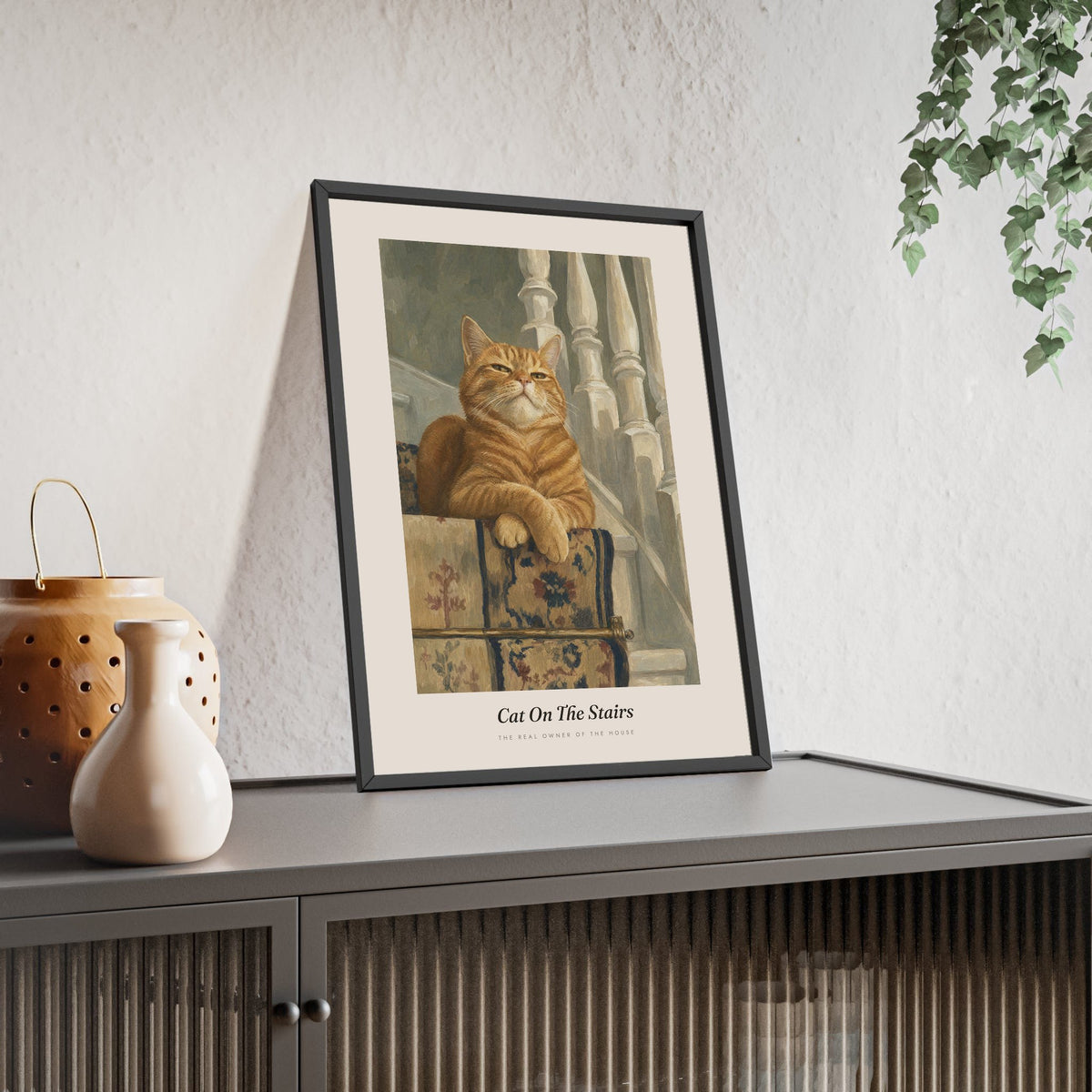 Cat on the Stairs Print framed and leaning on a sideboard