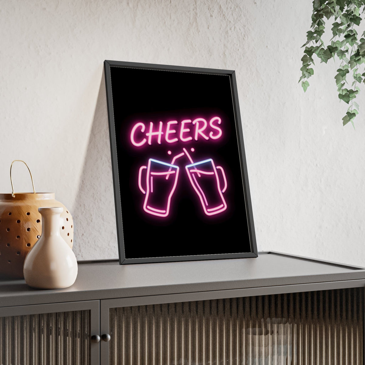 Cheers Neon Print framed and leaning on a sideboard