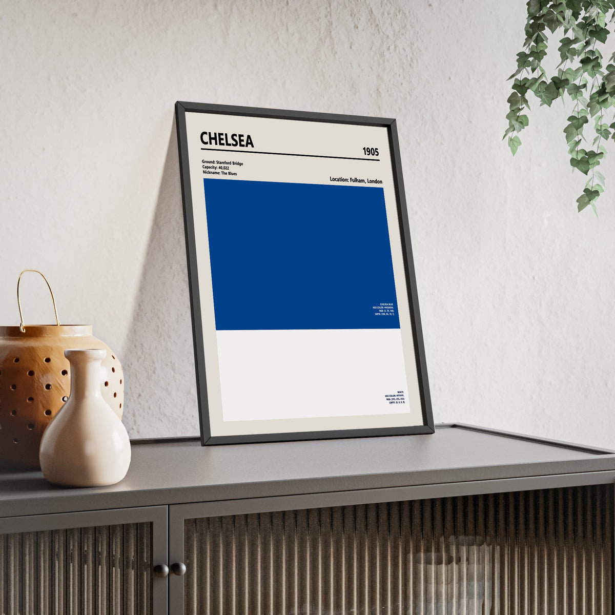Chelsea Colour Swatch Print framed and leaning on a sideboard