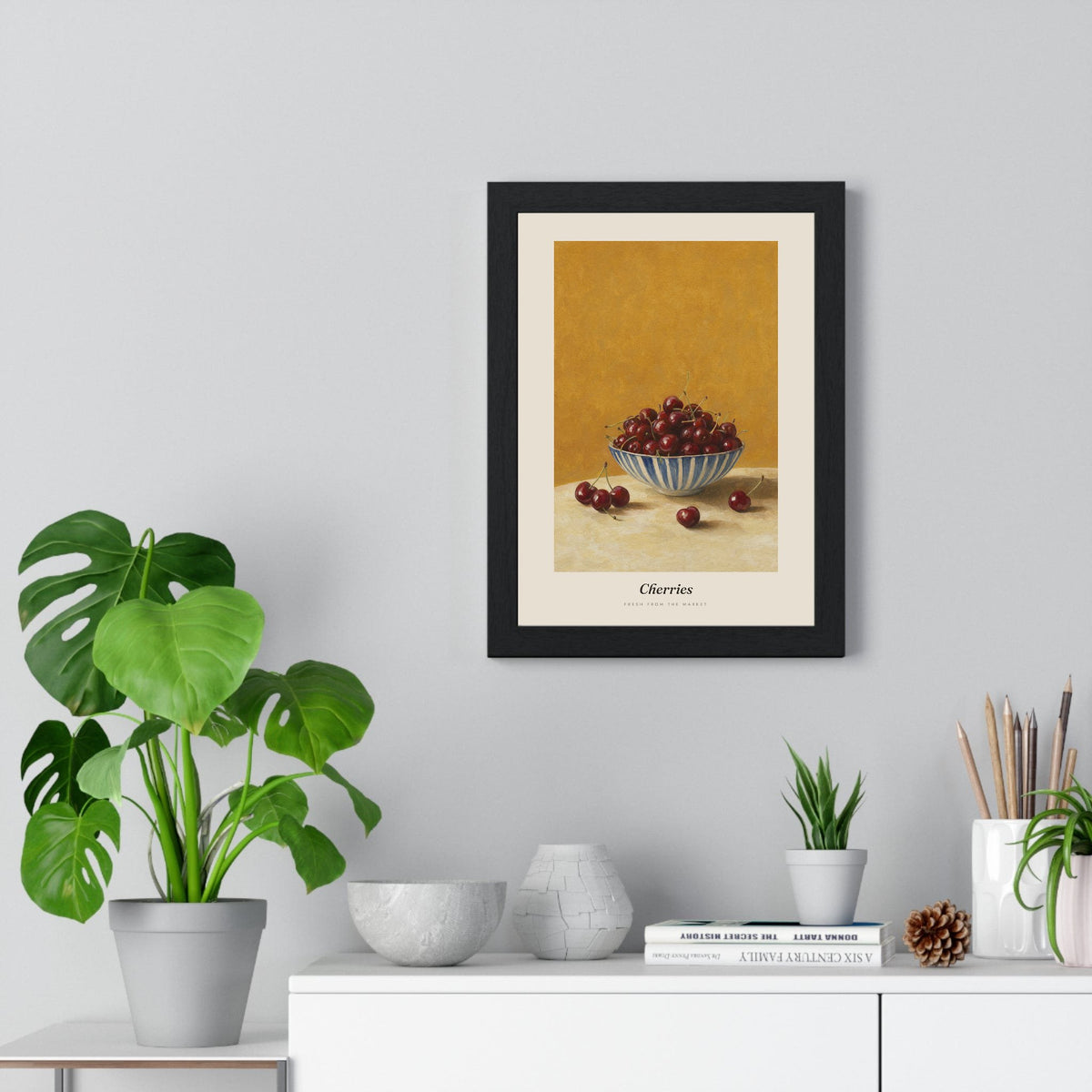 Cherries Print framed on a living room wall