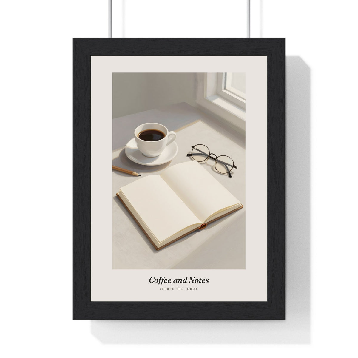 Coffee and Notebook Print - Home Office Wall Art framed in a black frame, ready to hang
