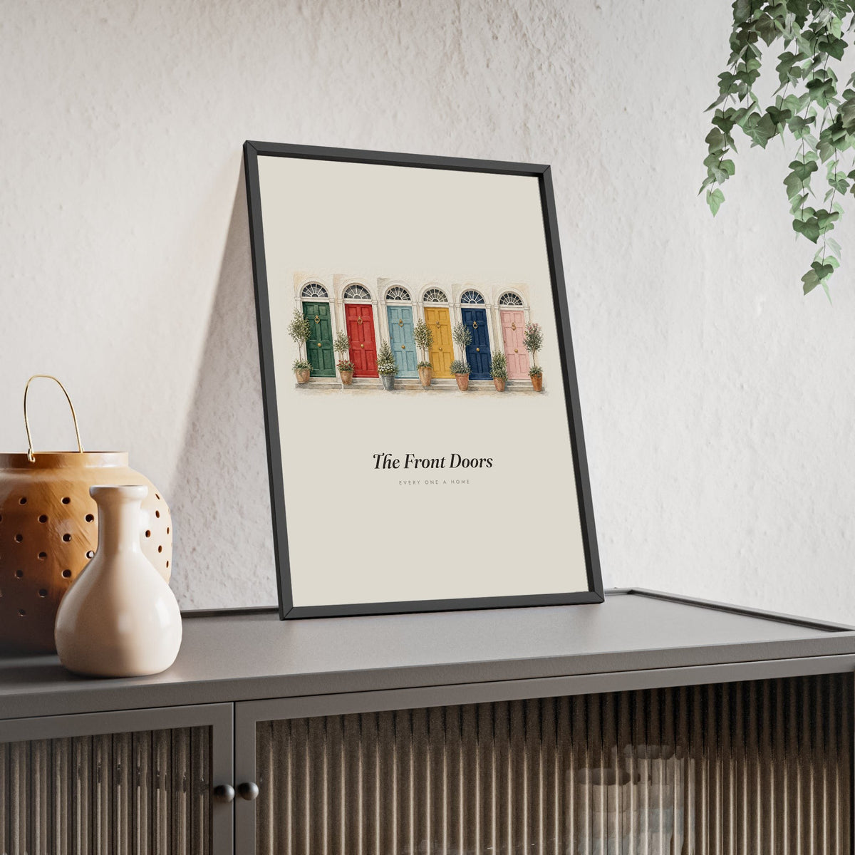 Colourful Front Doors Print framed and leaning on a sideboard