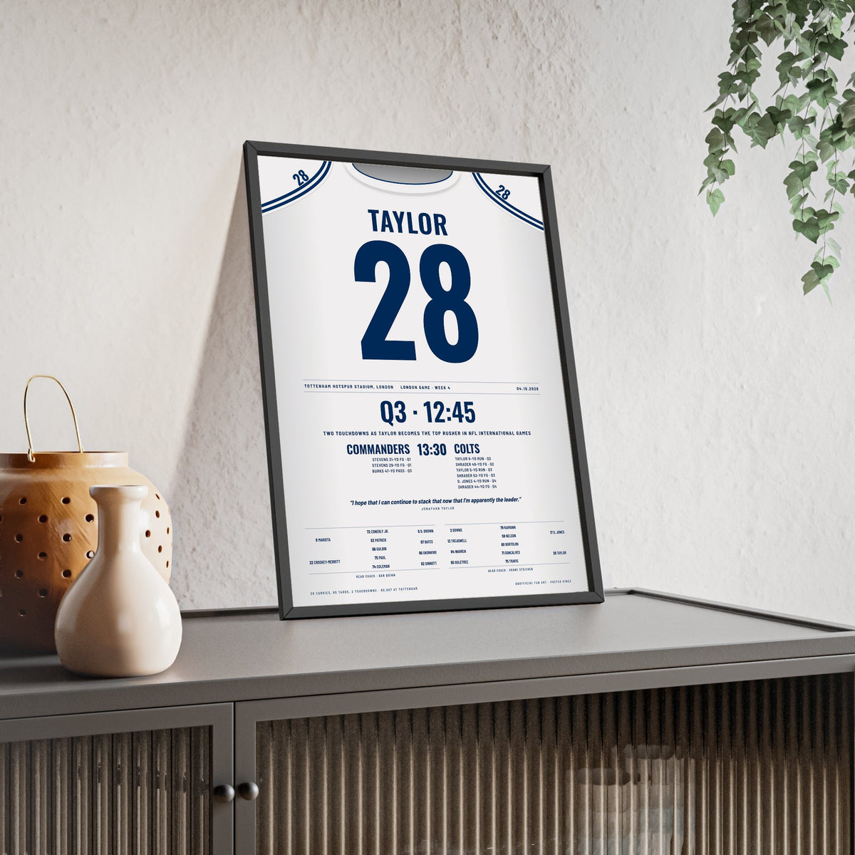 Indianapolis Colts London 2026 Poster - Jonathan Taylor 28 Tottenham v Commanders Jersey Print framed and leaning on a sideboard