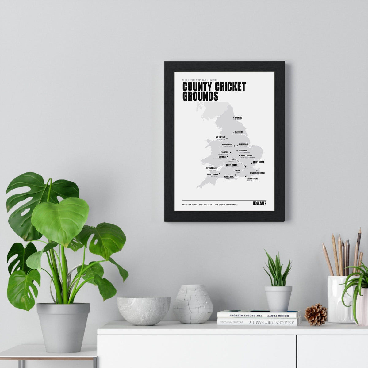 County Cricket Grounds Map print framed on a living room wall