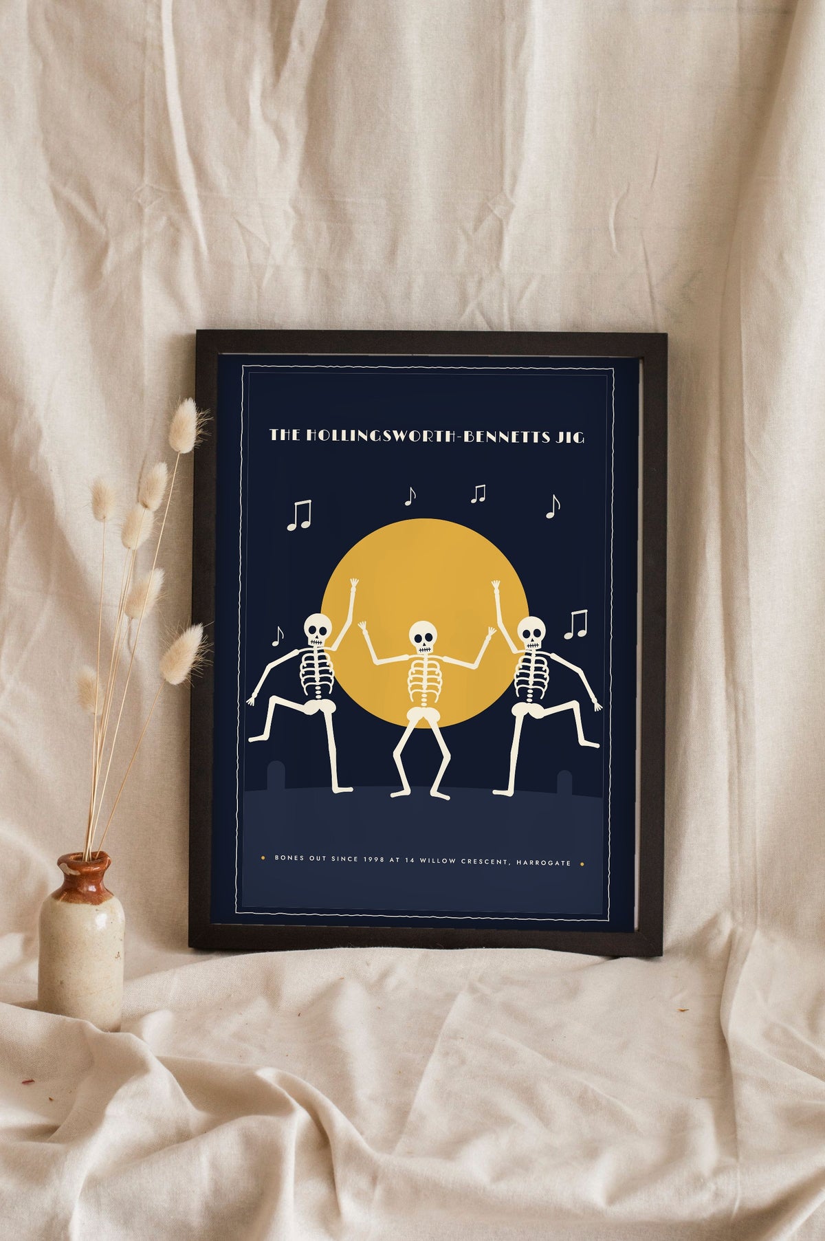 Dancing Skeletons Vintage Halloween Print - midnight navy family jig version leaning on a shelf