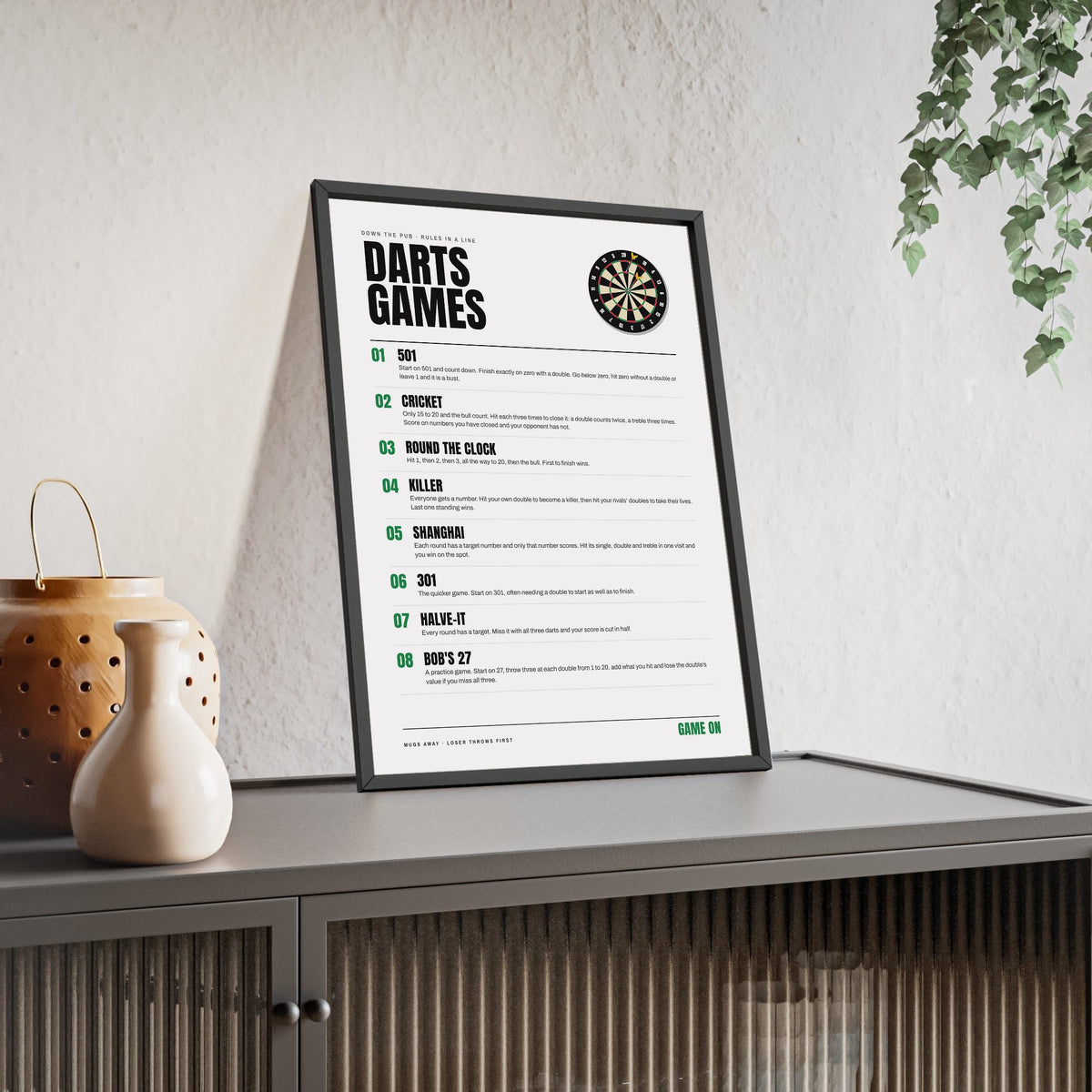 Darts Games print framed and leaning on a sideboard