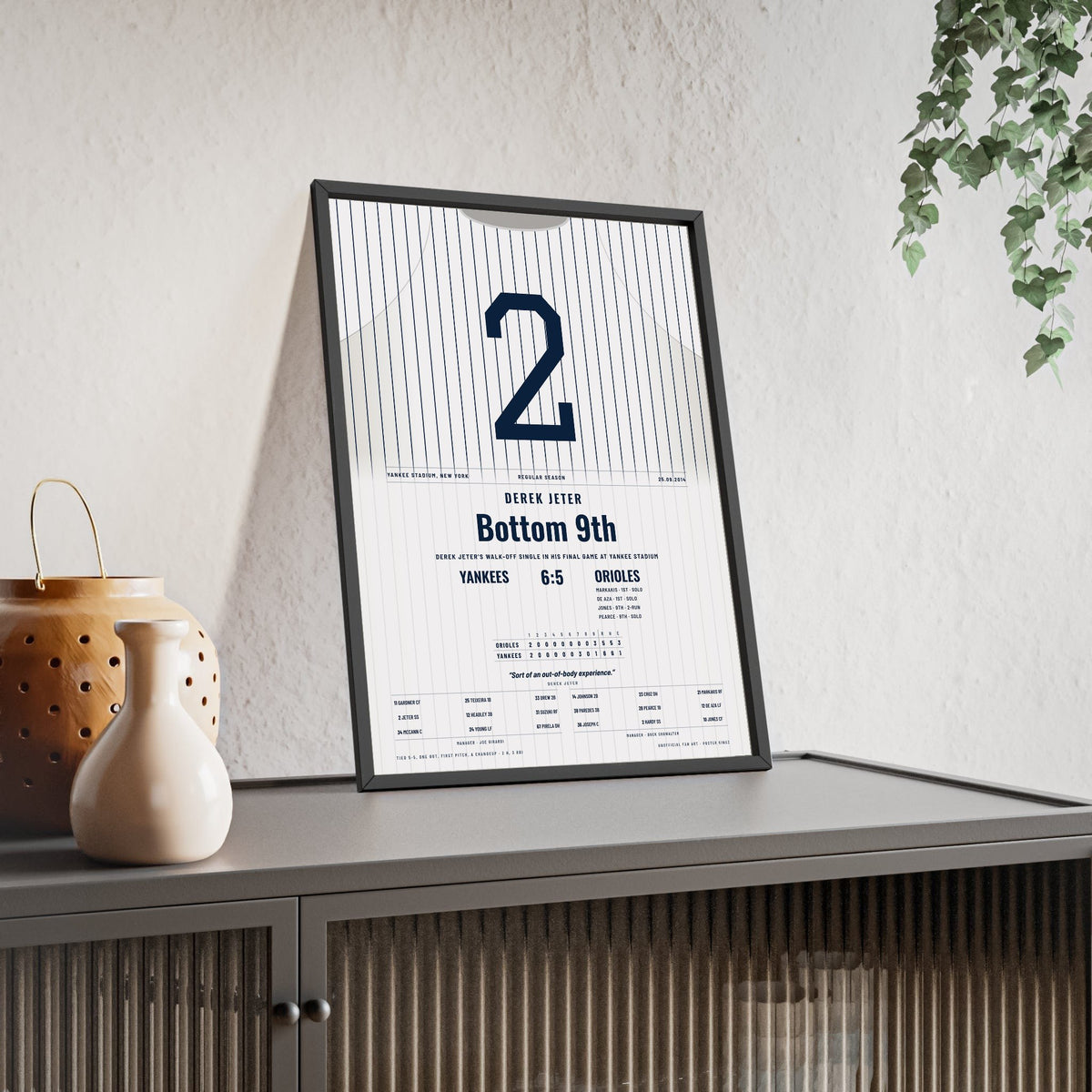 Derek Jeter 2014 Final Yankee Stadium Game Walk-Off Poster - New York Yankees 2 Jersey Print framed and leaning on a sideboard
