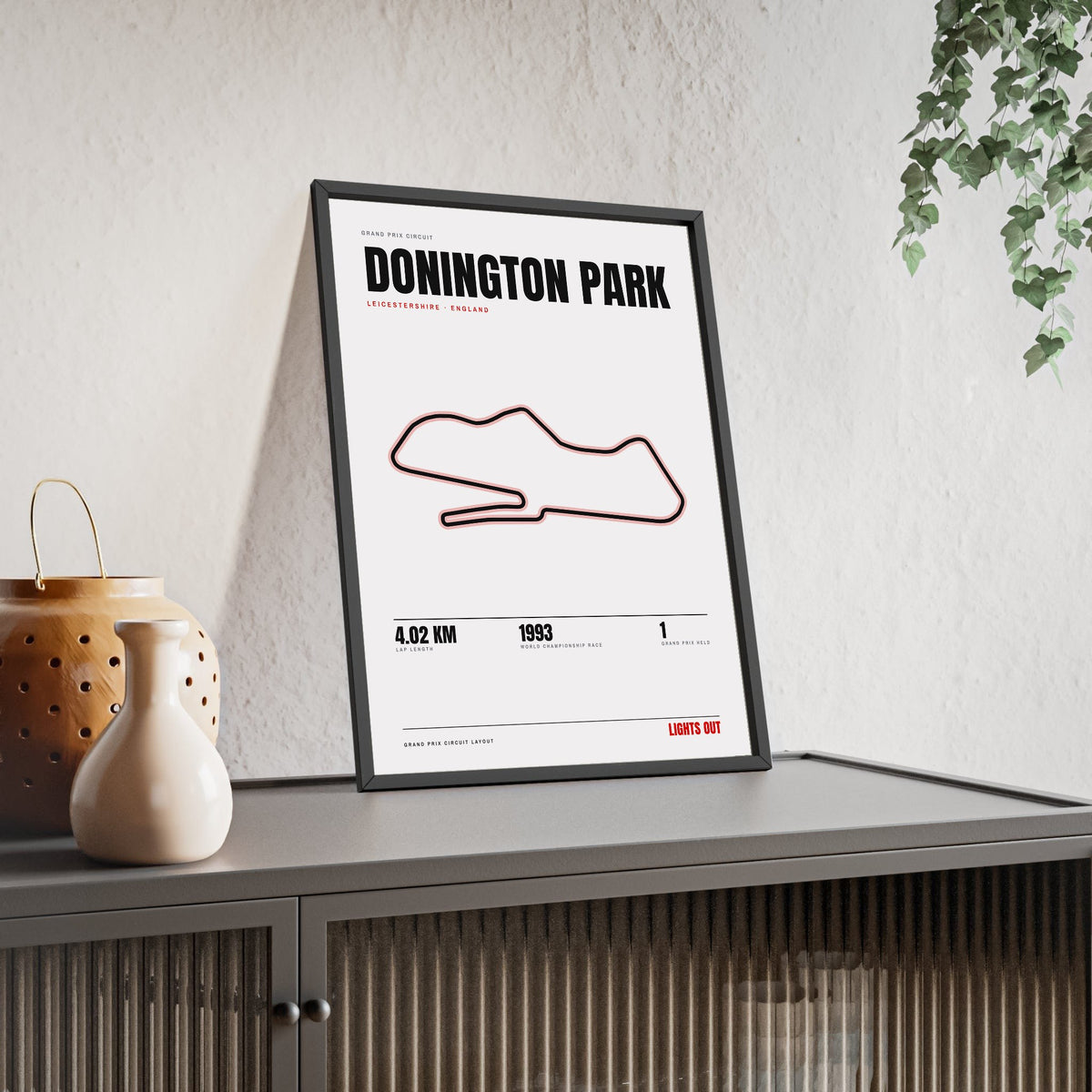 Donington Park Circuit print White framed and leaning on a sideboard