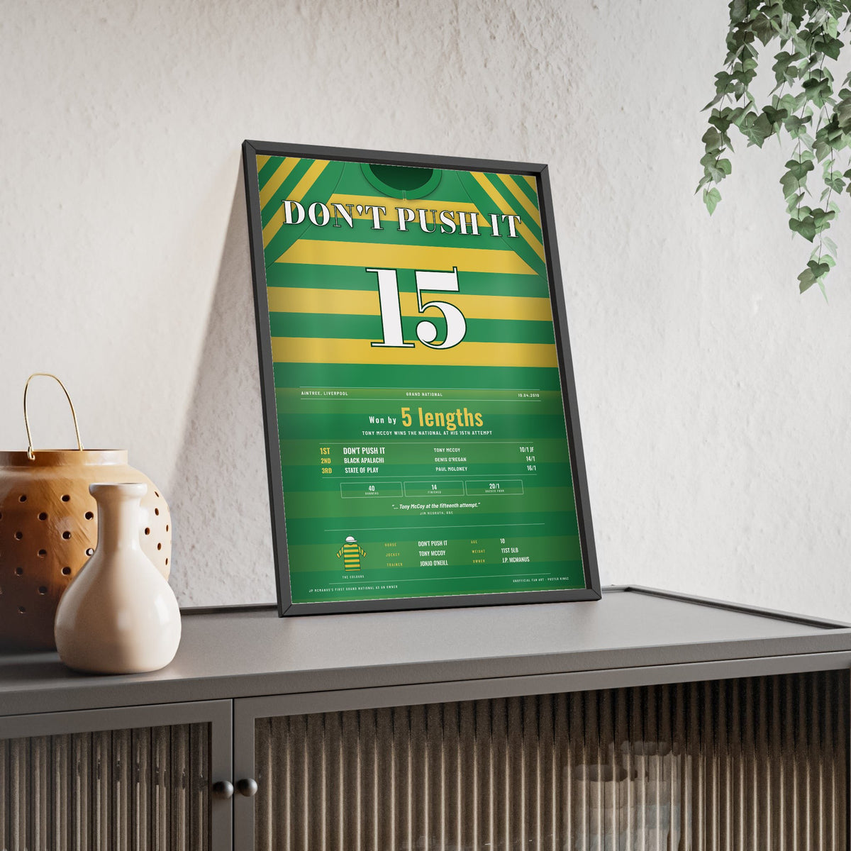 Don't Push It Grand National 2010 Horse Racing Poster - AP McCoy 15th Attempt Silks Print framed and leaning on a sideboard