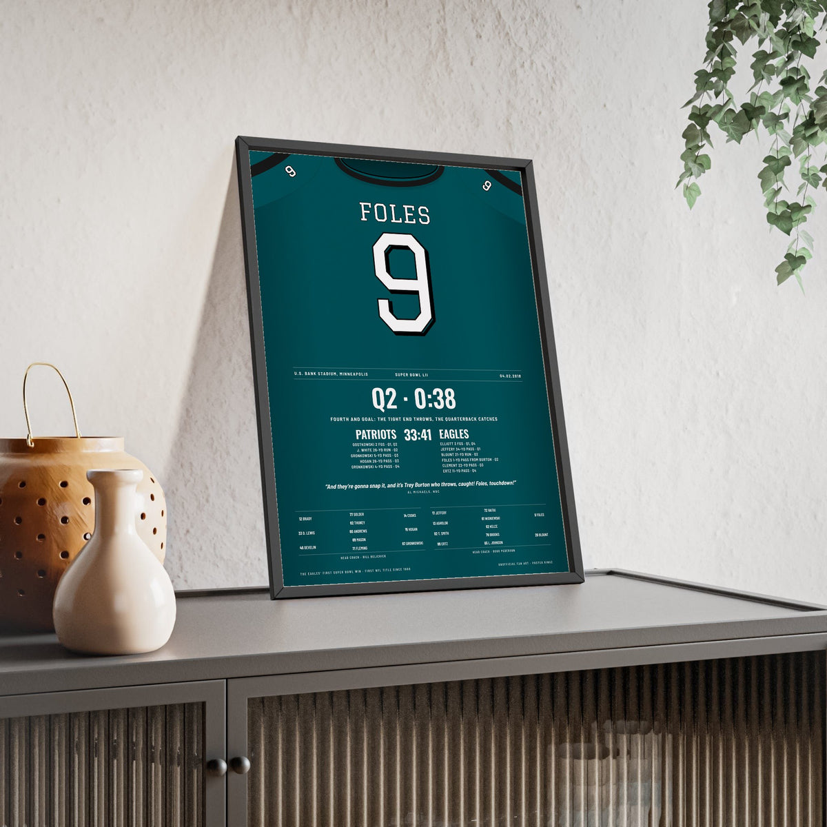 Philadelphia Eagles Super Bowl LII Poster - Nick Foles 9 Touchdown Catch Jersey Print framed and leaning on a sideboard