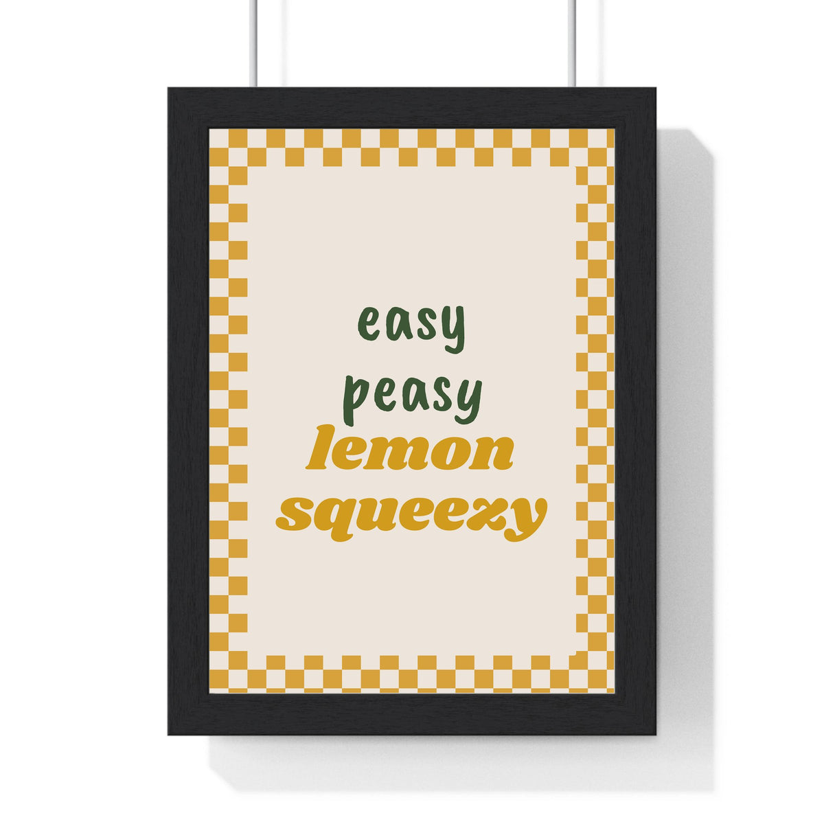 Easy Peasy Lemon Squeezy Print framed in a black frame, ready to hang