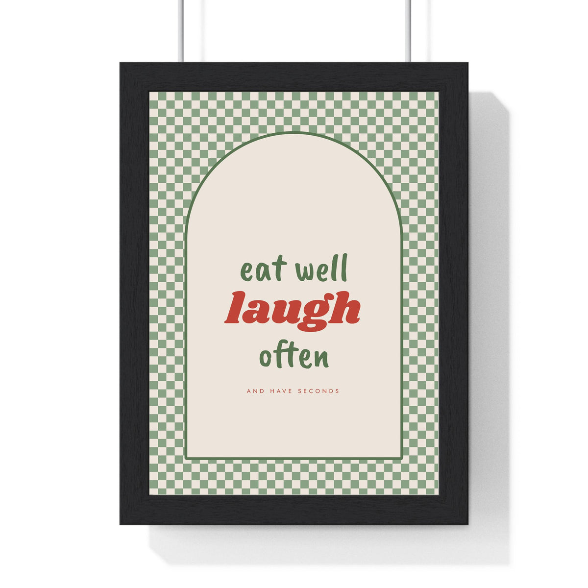 Eat Well Laugh Often Print framed in a black frame, ready to hang
