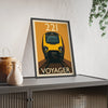 Framed poster of a train labeled 'Voyager' on a shelf with decorative items.