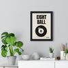 Eight Ball print framed on a living room wall