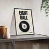 Eight Ball print framed and leaning on a sideboard