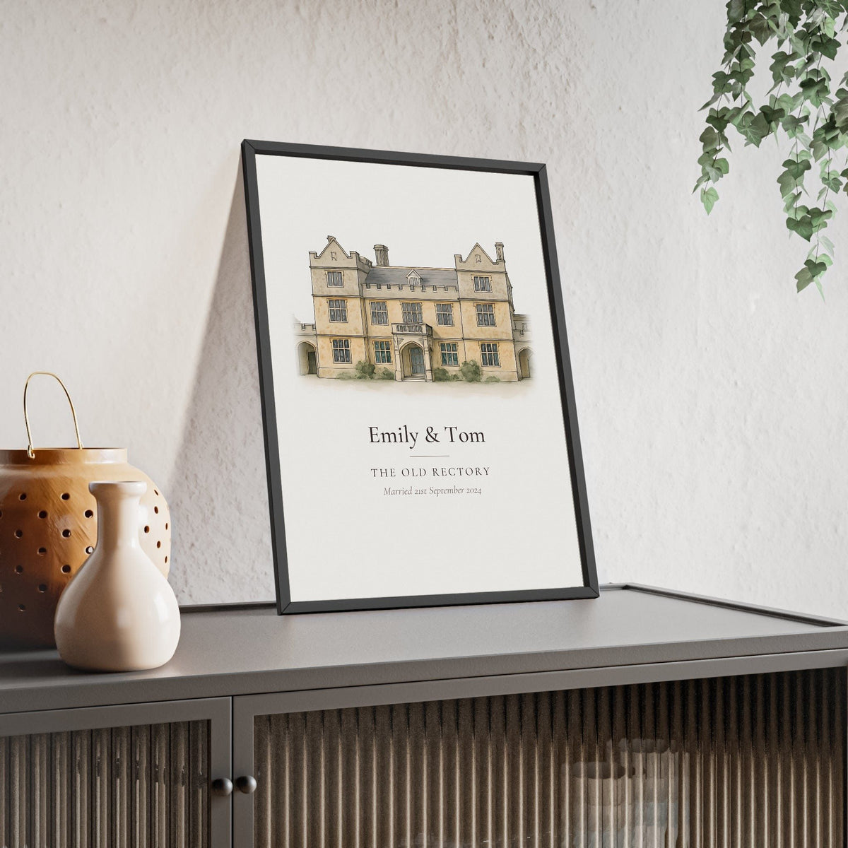 Wedding venue illustration from photo: a stone manor house painted in watercolour and ink, with the couple names, venue name and wedding date, framed anniversary print