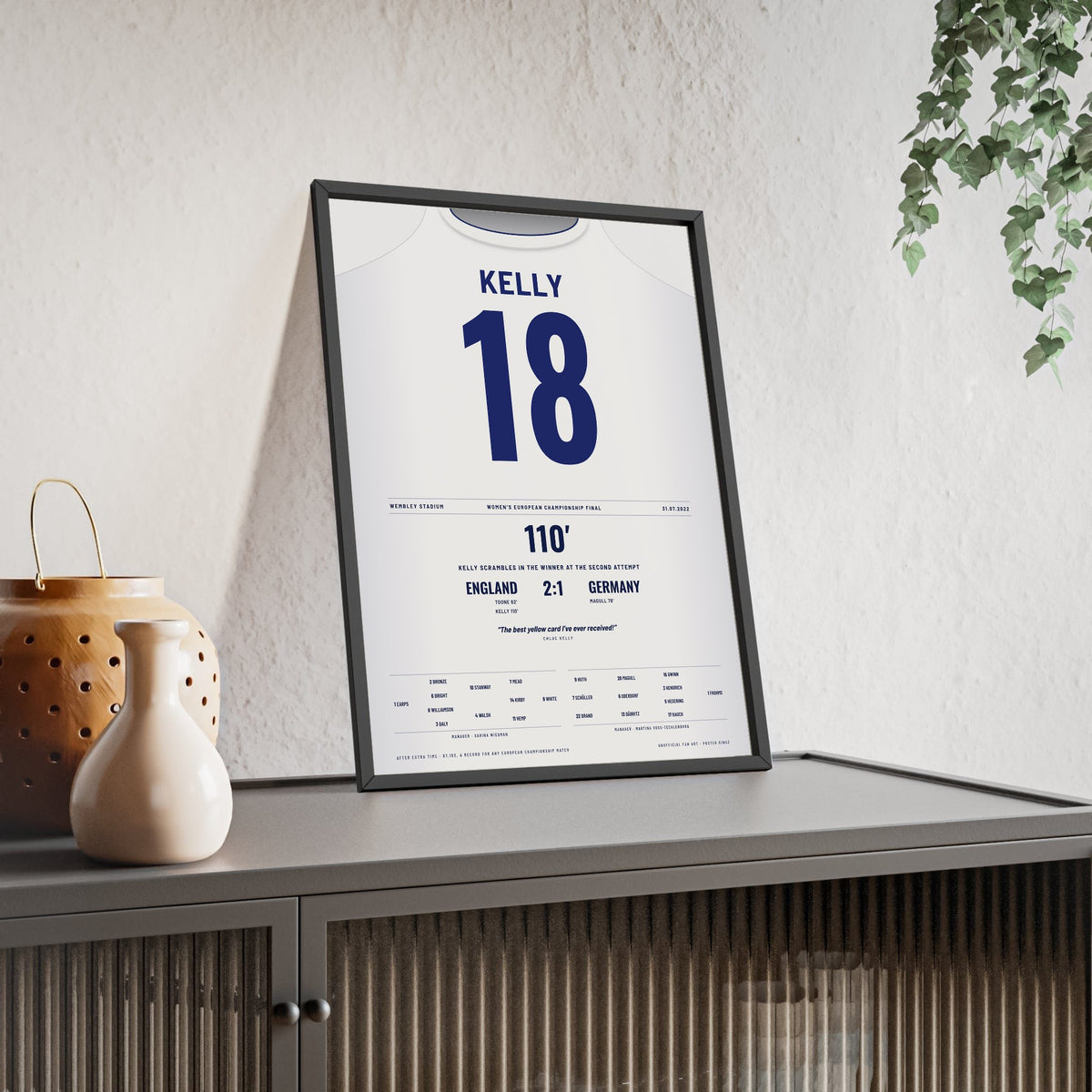 England Lionesses Women's Euro 2022 Final Poster - Chloe Kelly 18 Wembley Shirt Print framed and leaning on a sideboard