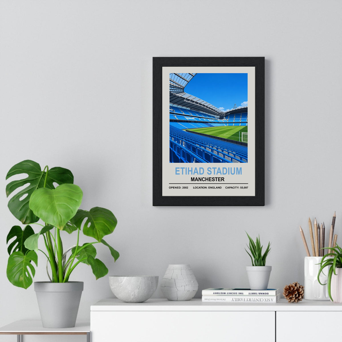 Manchester City Etihad Stadium print framed on a living room wall