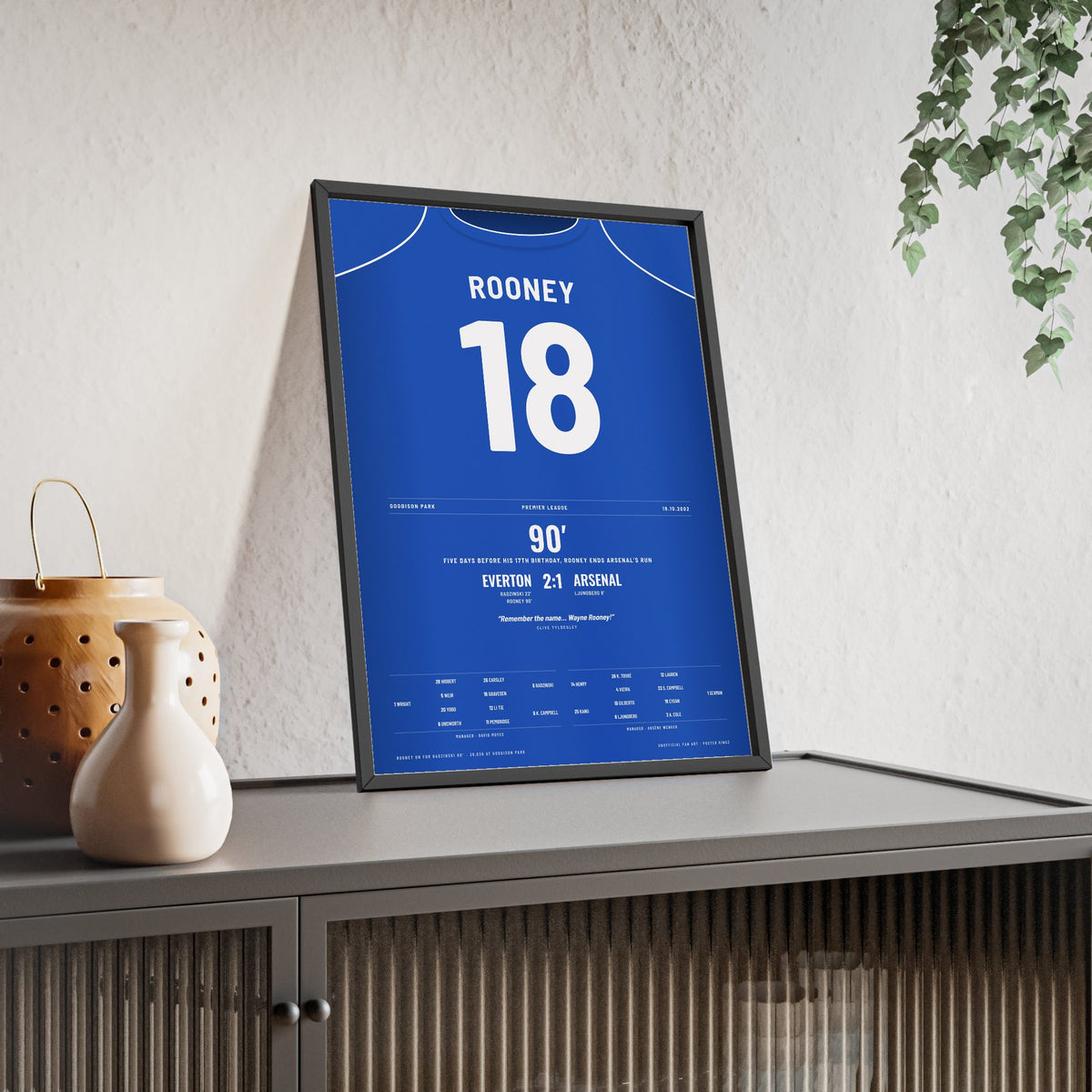 Everton Rooney Goal v Arsenal 2002 Poster - Wayne Rooney 18 Remember the Name Shirt Print framed and leaning on a sideboard