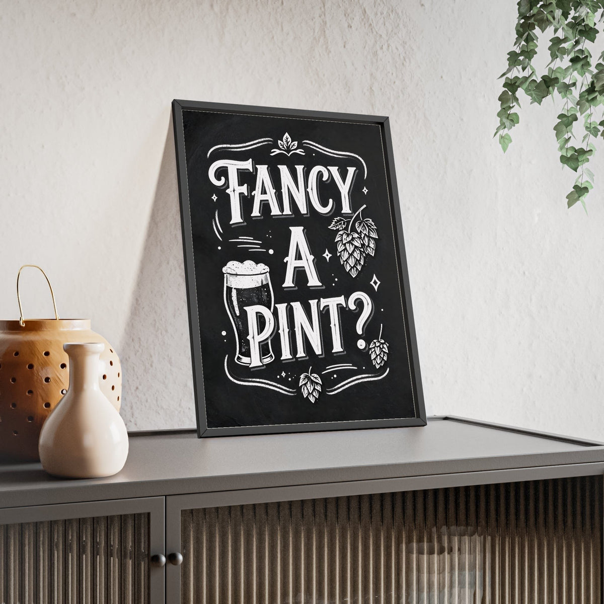Fancy A Pint Chalkboard Print framed and leaning on a sideboard