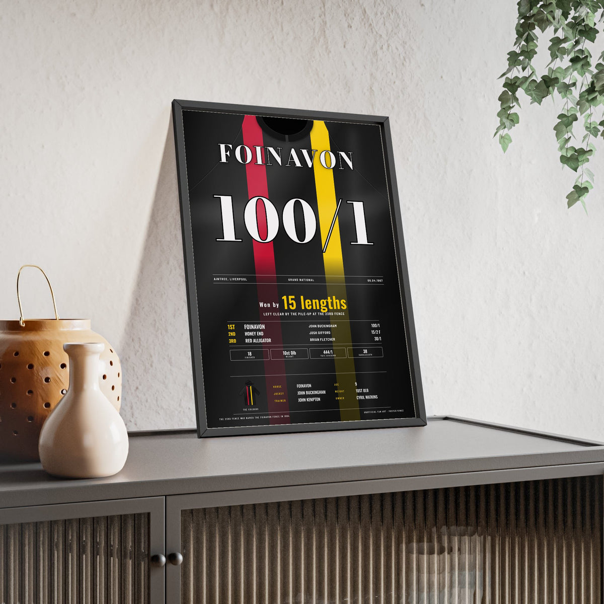Foinavon Grand National 1967 Horse Racing Poster - 100/1 Winner Silks Print framed and leaning on a sideboard