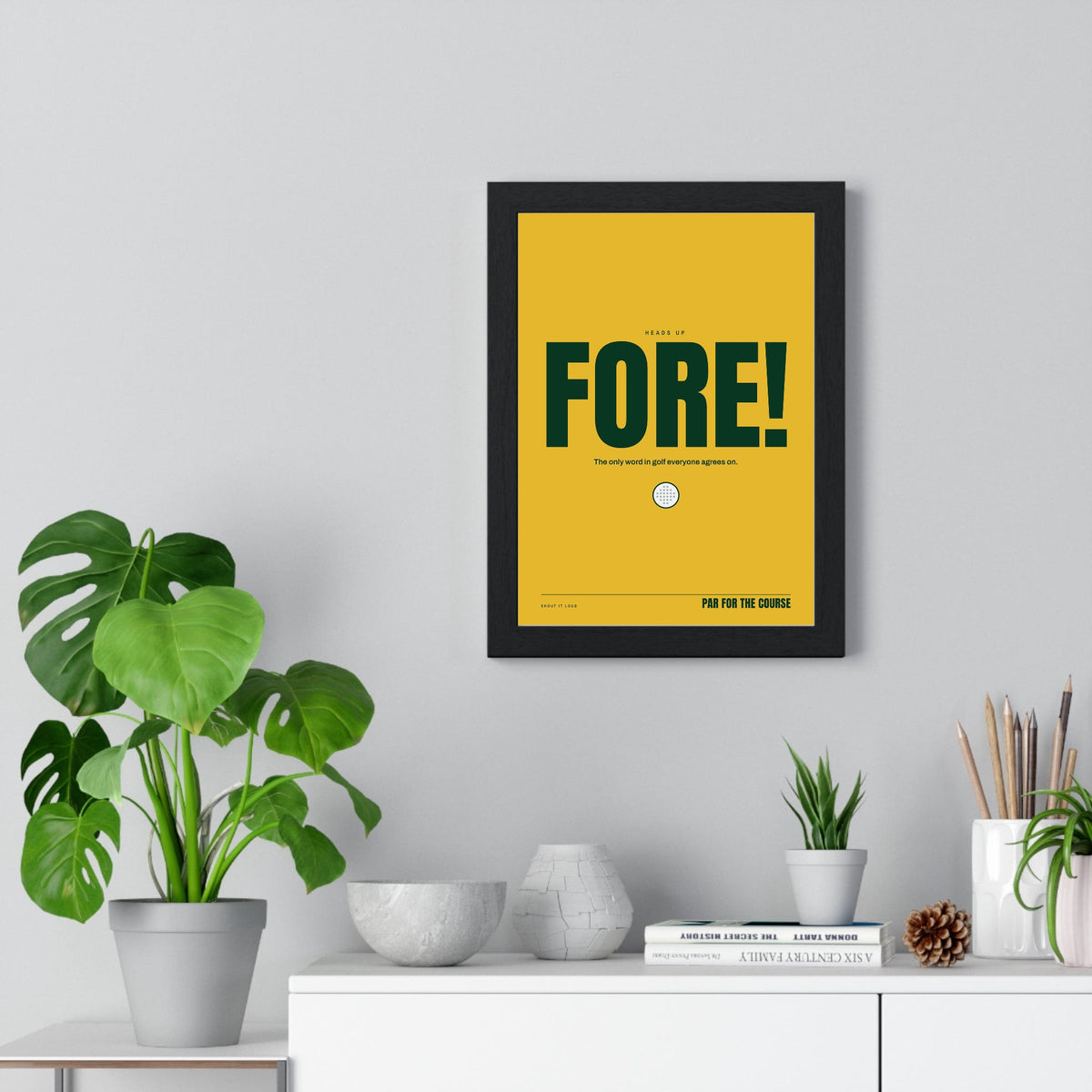 Fore! Golf print framed on a living room wall