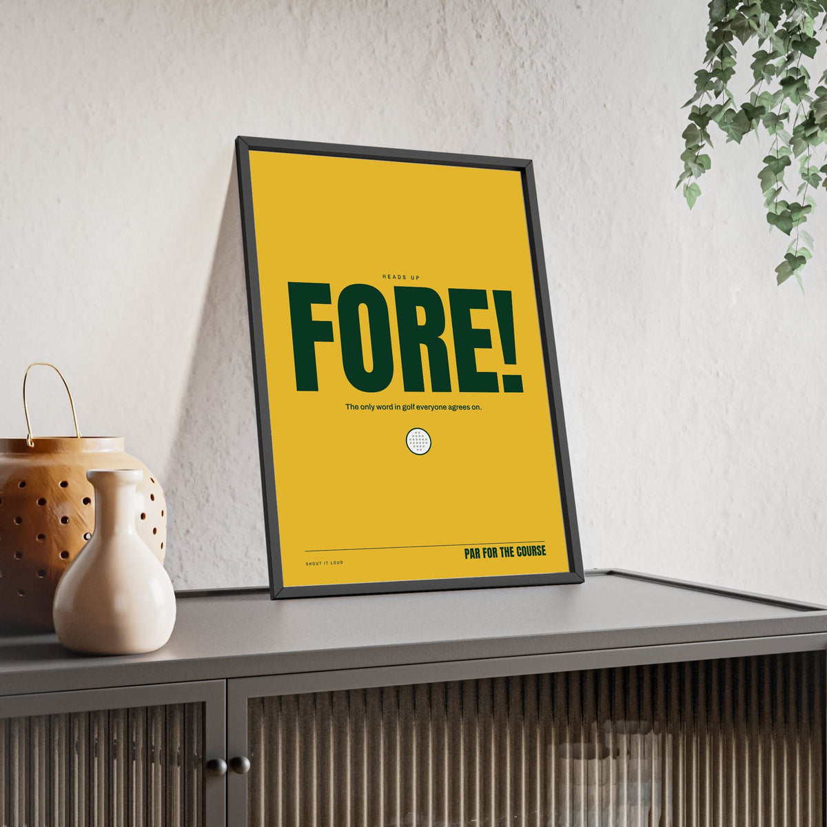 Fore! Golf print framed and leaning on a sideboard