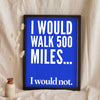 Funny 500 Miles lyric print in a black frame propped up on linen