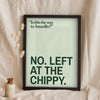 Funny Amarillo lyric print in a black frame propped up on linen