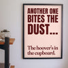 Funny Another One Bites the Dust lyric print framed on a wall