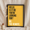 Funny Hello lyric print in a black frame propped up on linen