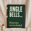 Funny Jingle Bells lyric print in a black frame propped up on linen