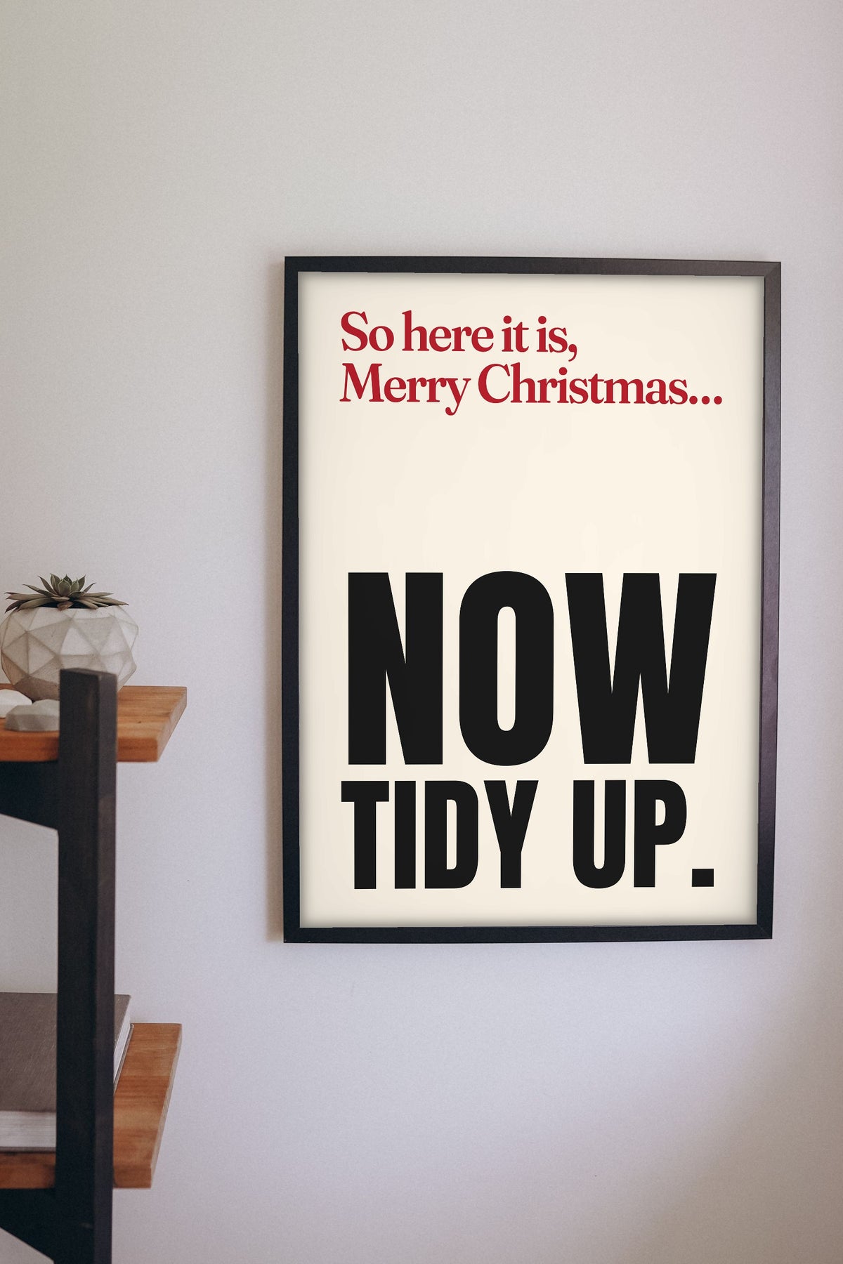 Funny Merry Xmas Everybody lyric print framed on a wall