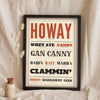 Geordie Slang Print in a black frame propped up on linen