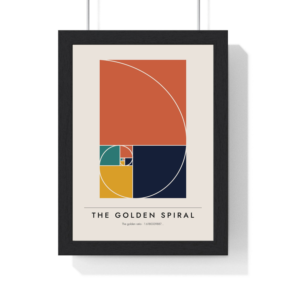 Golden Spiral print framed in a black frame, ready to hang