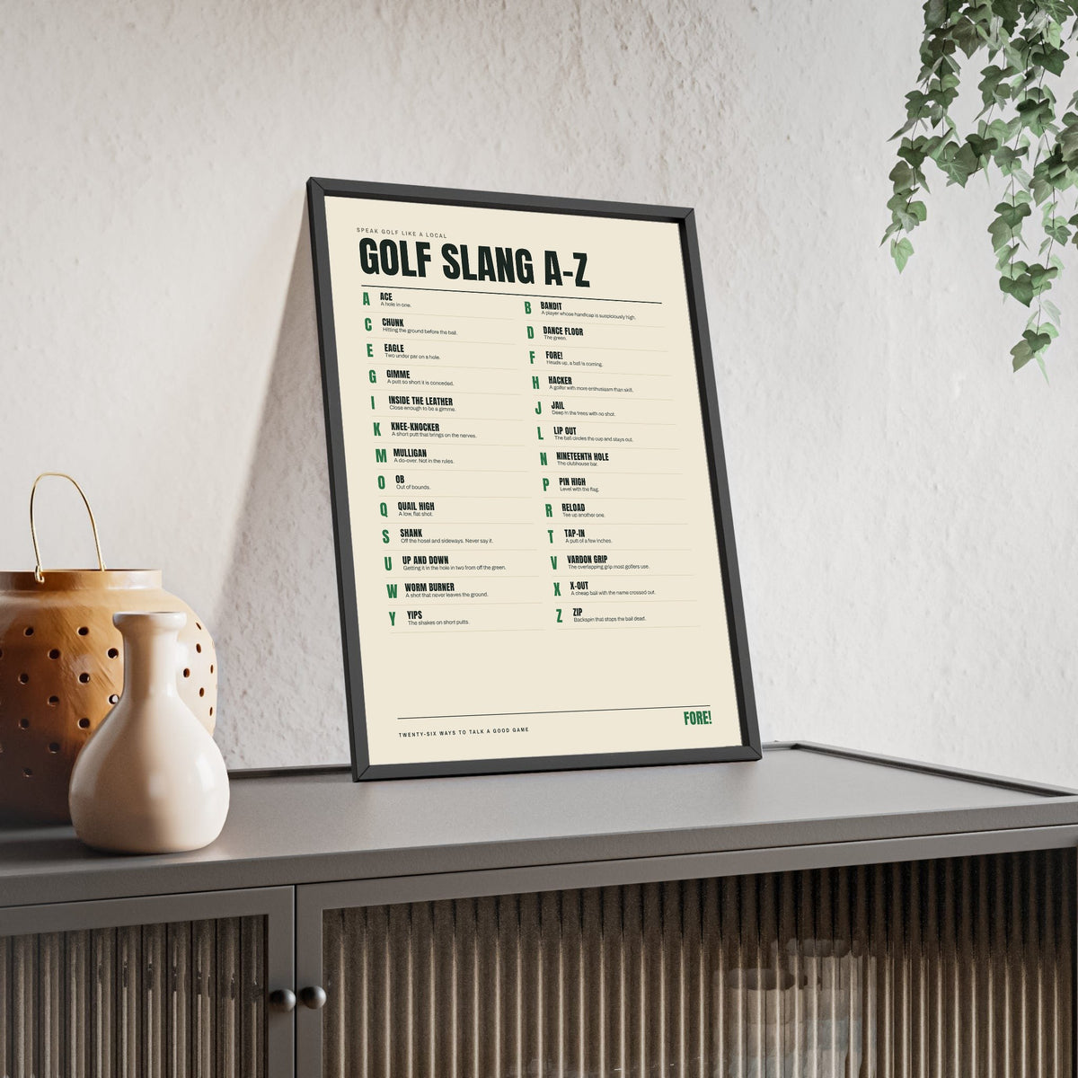 Golf Slang A-Z print framed and leaning on a sideboard