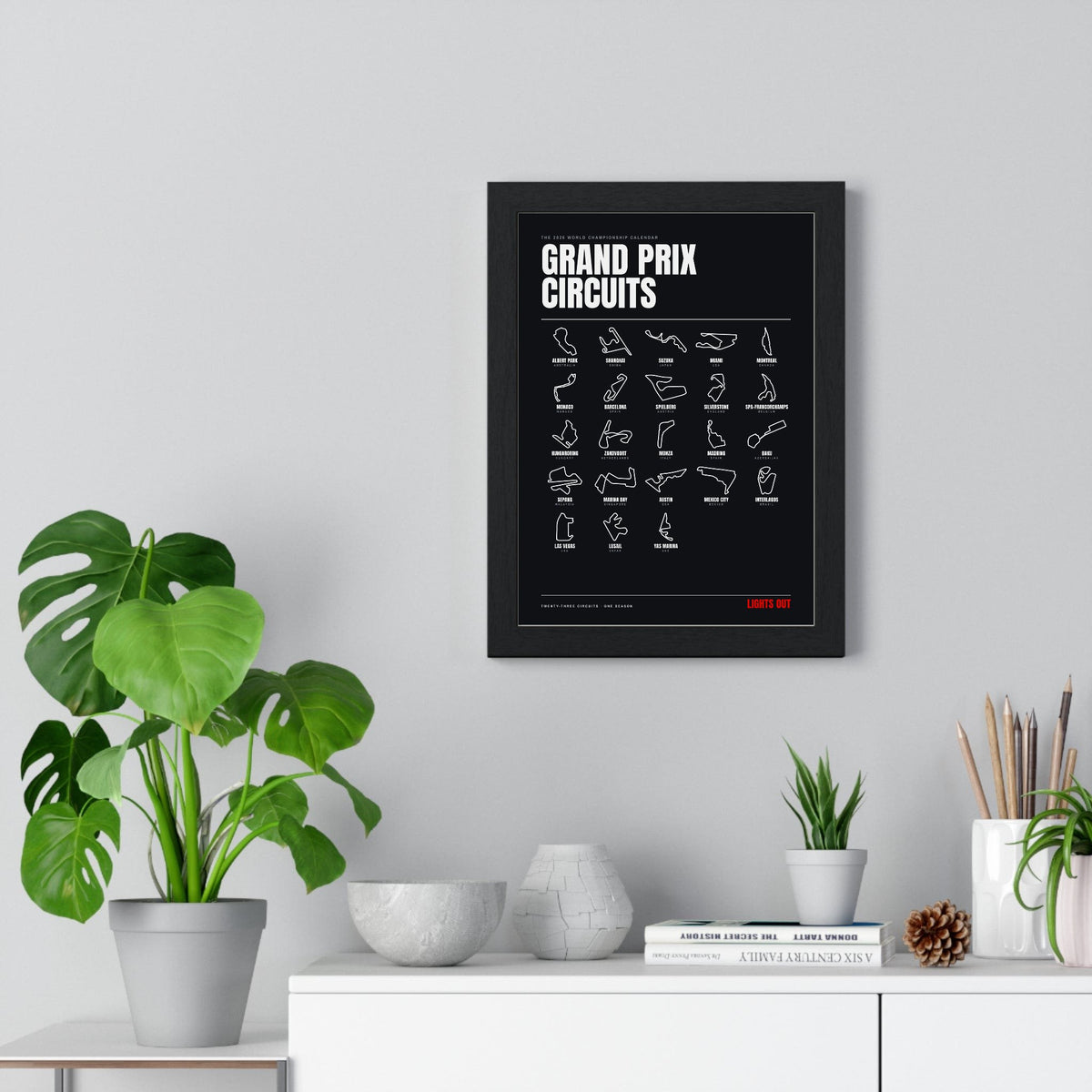 Grand Prix Circuits 2026 print framed on a living room wall