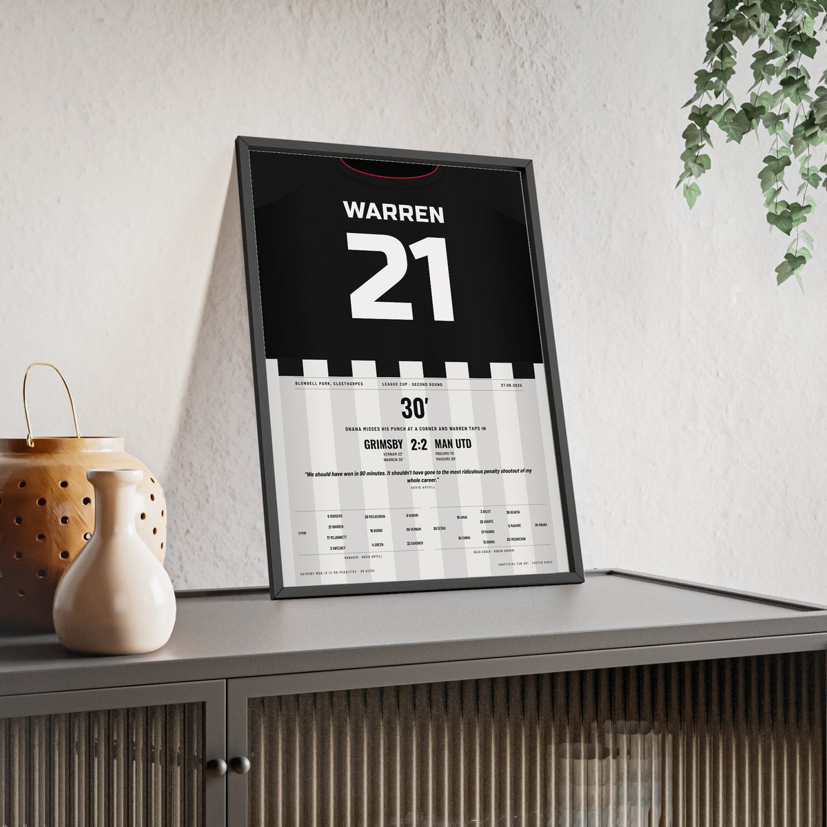 Grimsby Town v Man Utd League Cup 2025 Poster - Warren 21 Shirt Print framed and leaning on a sideboard