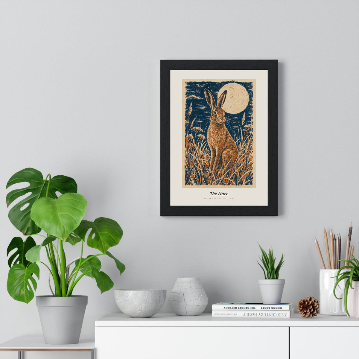 Hare and Moon Print framed on a living room wall