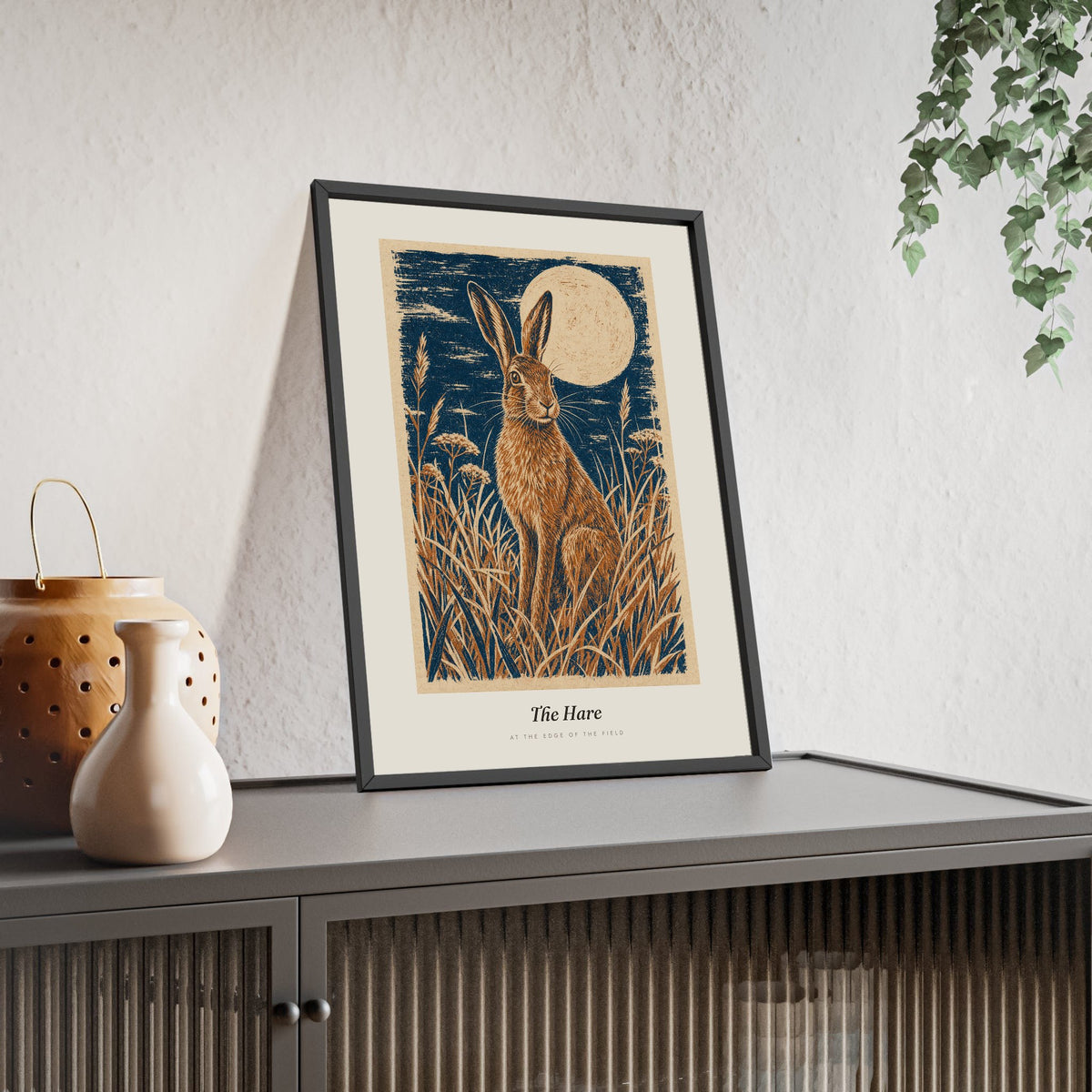 Hare and Moon Print framed and leaning on a sideboard