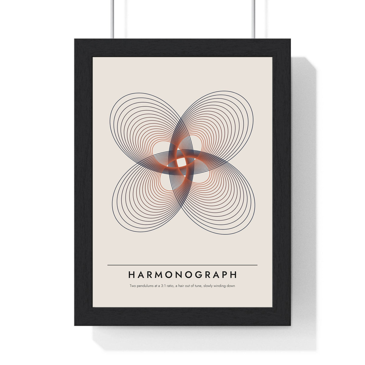 Harmonograph print framed in a black frame, ready to hang