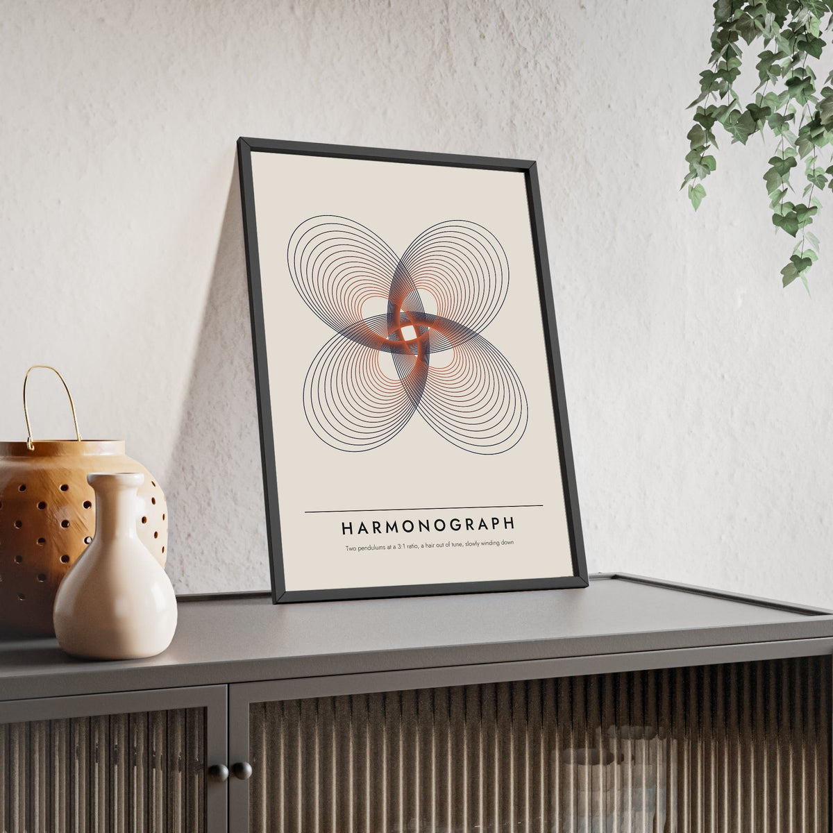 Harmonograph print framed and leaning on a sideboard
