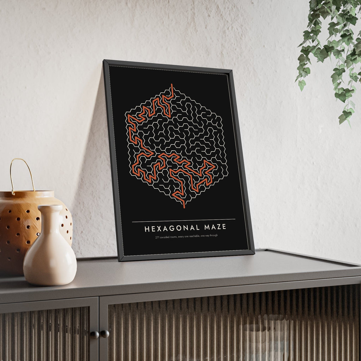 Hexagonal Maze print framed and leaning on a sideboard