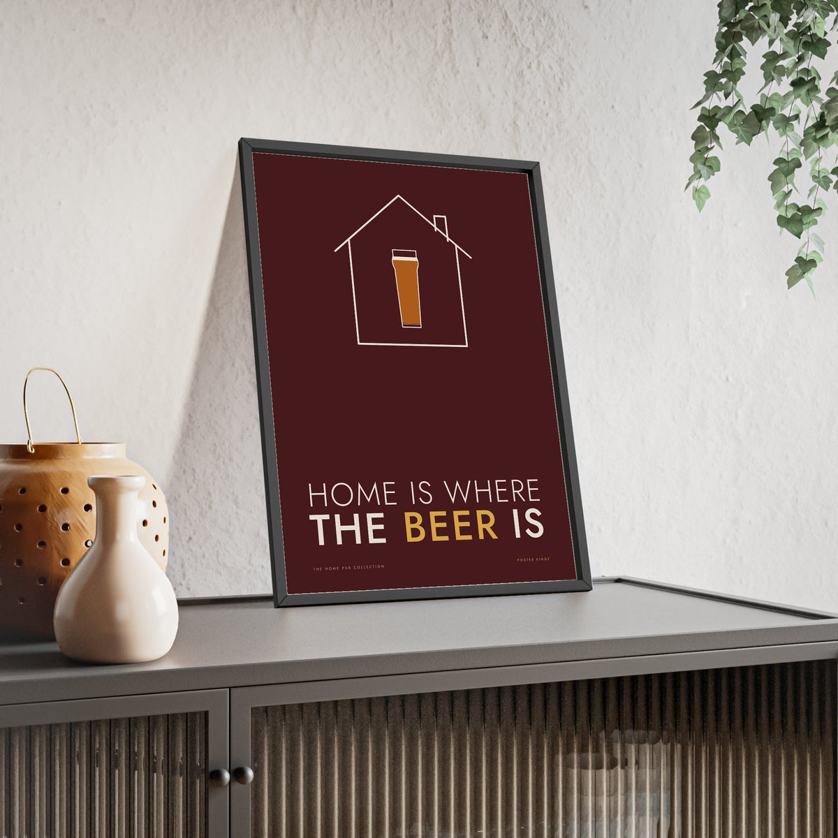 Home Is Where The Beer Is Print framed and leaning on a sideboard