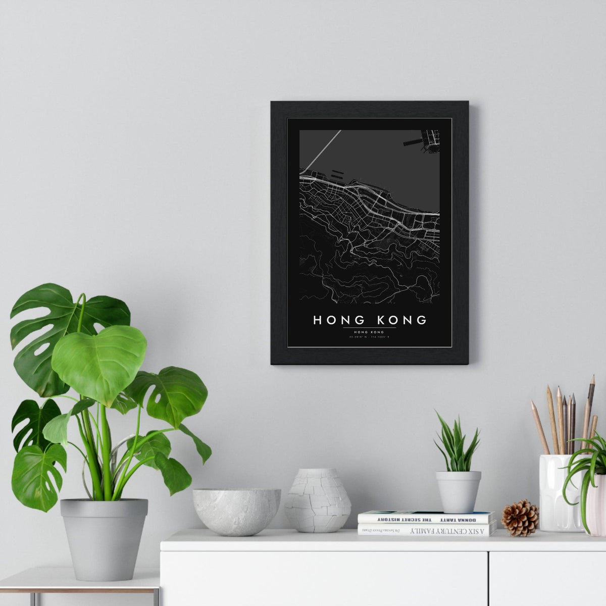 Hong Kong street map poster in black, minimal city map print framed on a living room wall