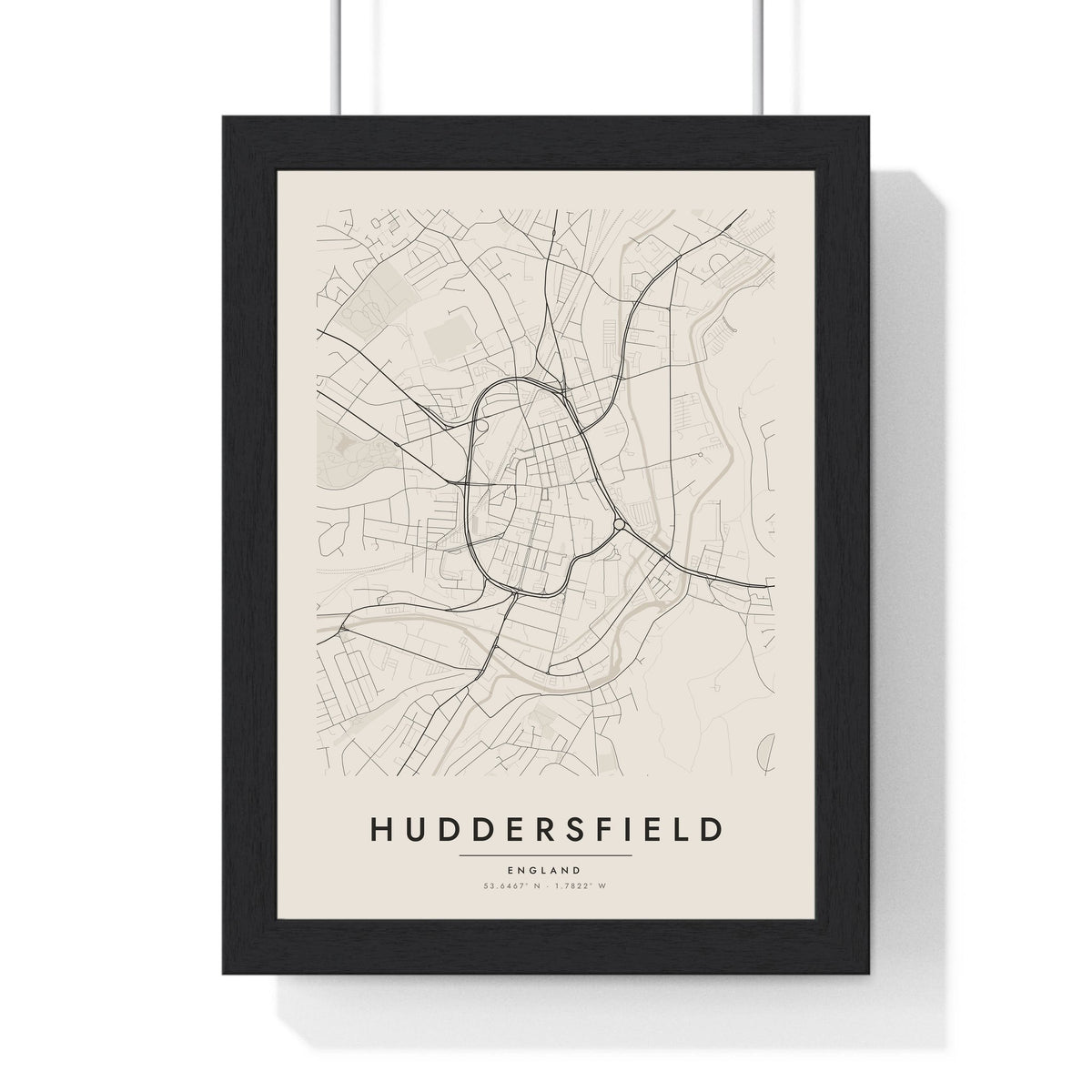 Huddersfield street map poster in cream, minimal city map print framed in a black frame