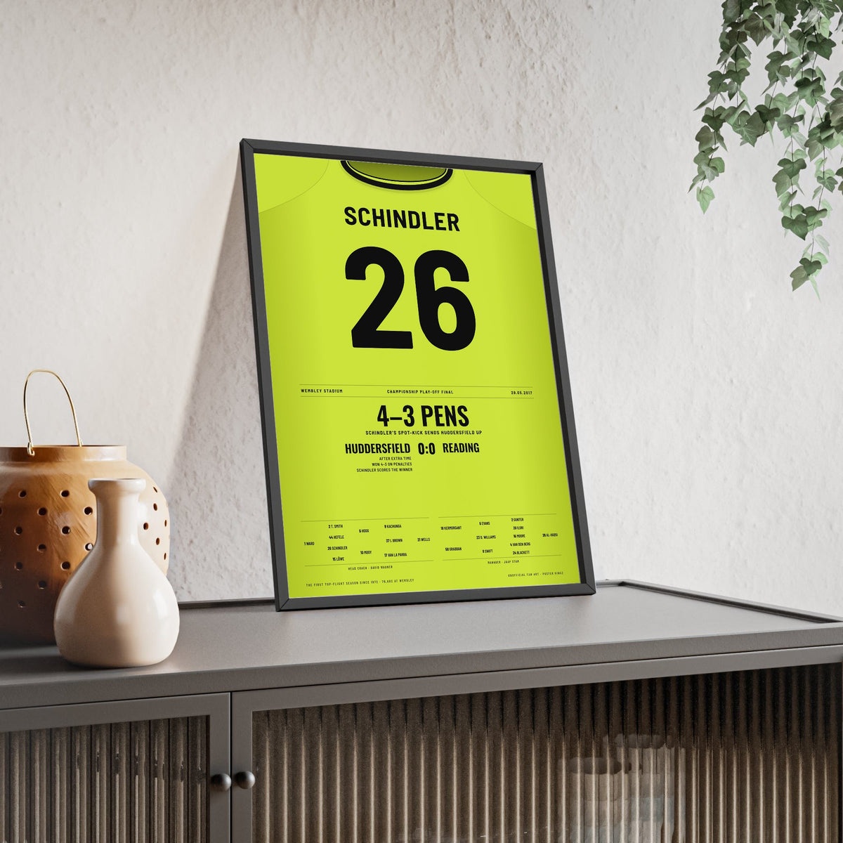 Huddersfield Town Play-Off Final 2017 Poster - Christopher Schindler 26 Winning Penalty Shirt Print framed and leaning on a sideboard