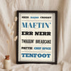 Hull Sayings Print in a black frame propped up on linen