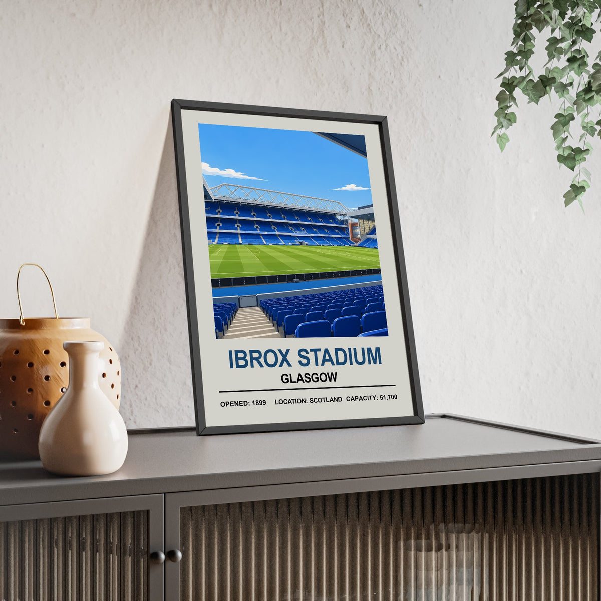 Rangers Ibrox Stadium print framed and leaning on a sideboard